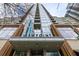 A low angle shot of the building highlighting a glass, brick and stone design at 855 Peachtree Ne St # 1911, Atlanta, GA 30308