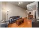 Spacious living area with hardwood floors, comfortable seating, and an open layout with kitchen access at 855 Peachtree Ne St # 1911, Atlanta, GA 30308