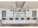Stylish bar area features modern stools, pendant lighting, and a sleek countertop, creating a perfect space for socializing at 923 Peachtree Ne St # 1527, Atlanta, GA 30309