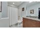 Clean bathroom with combination shower and tub, granite countertops, and ample storage at 923 Peachtree Ne St # 1527, Atlanta, GA 30309