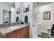 Bathroom featuring granite countertops, modern fixtures, and access to laundry area at 923 Peachtree Ne St # 1527, Atlanta, GA 30309