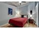 Cozy bedroom with ceiling fan, neutral wall color, and hardwood floors at 923 Peachtree Ne St # 1527, Atlanta, GA 30309