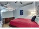 Bedroom with a hardwood floor, concrete ceiling and a painting on the wall at 923 Peachtree Ne St # 1527, Atlanta, GA 30309