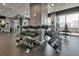 Spacious gym features weight racks, exercise machines, and city views at 923 Peachtree Ne St # 1527, Atlanta, GA 30309