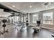 Well-lit gym offers various machines and free weights at 923 Peachtree Ne St # 1527, Atlanta, GA 30309