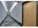 Condo hallway leading to a unit with stylish carpet and modern lighting at 923 Peachtree Ne St # 1527, Atlanta, GA 30309