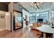 Open-concept living space with hardwood floors, concrete ceilings, and views of the city at 923 Peachtree Ne St # 1527, Atlanta, GA 30309
