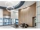 Bright lobby with modern lighting, wood paneled walls, seating area, and revolving glass door entrance at 923 Peachtree Ne St # 1527, Atlanta, GA 30309