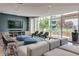 Relaxing lounge area with comfortable seating, a large TV, and a view of the outdoor terrace at 923 Peachtree Ne St # 1527, Atlanta, GA 30309