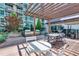 Beautiful outdoor terrace with a grill, covered dining, and comfortable seating offers views of the city at 923 Peachtree Ne St # 1527, Atlanta, GA 30309