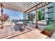 Outdoor grill and dining area on a wooden deck with city views, perfect for entertaining at 923 Peachtree Ne St # 1527, Atlanta, GA 30309