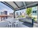 Rooftop outdoor kitchen with stainless steel grills and city views at 923 Peachtree Ne St # 1527, Atlanta, GA 30309