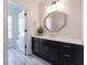 Bathroom features a gray vanity with white countertop, and a glass enclosed shower/tub combo at 200 Rivermere Way, Sandy Springs, GA 30350