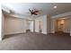 Spacious bonus room with plush carpet and multiple doorways to other rooms in the house at 200 Rivermere Way, Sandy Springs, GA 30350