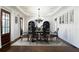 Elegant dining room featuring hardwood floors, sophisticated chandelier, and ample seating at 200 Rivermere Way, Sandy Springs, GA 30350
