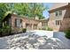 Attached two-car garage featuring brick facade, brown doors, and adjacent parking space at 200 Rivermere Way, Sandy Springs, GA 30350