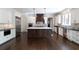 Gourmet kitchen features stainless steel appliances, custom cabinets, and center island at 200 Rivermere Way, Sandy Springs, GA 30350