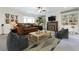 A vibrant living room with a comfortable couch, beanbag chairs, and built-in shelving at 200 Rivermere Way, Sandy Springs, GA 30350