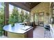 Outdoor kitchen featuring a stainless steel grill, wet bar, and outdoor seating at 200 Rivermere Way, Sandy Springs, GA 30350