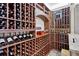 Exceptional wine cellar with wooden racks to house a large collection of wine bottles for the enthusiast at 200 Rivermere Way, Sandy Springs, GA 30350