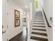 Bright entryway with modern staircase and stylish wall art at 241 Maynard Se Ter # 17, Atlanta, GA 30316