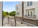 Modern townhouse exterior with a balcony and views of the street at 241 Maynard Se Ter # 17, Atlanta, GA 30316
