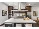 Modern kitchen features a large island, stainless steel appliances, and dark wood floors at 241 Maynard Se Ter # 17, Atlanta, GA 30316