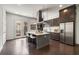 Modern kitchen features a large island, stainless steel appliances, and dark wood floors at 241 Maynard Se Ter # 17, Atlanta, GA 30316