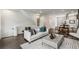 Open-concept living area with modern decor, hardwood floors, and lots of natural light at 241 Maynard Se Ter # 17, Atlanta, GA 30316