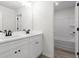 Bathroom with double vanity featuring modern fixtures and white cabinets, offering a sleek design at 2949 Jefferson St, Austell, GA 30106