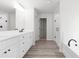 White bathroom featuring double vanity, shower, tub, and modern fixtures for a luxurious feel at 2949 Jefferson St, Austell, GA 30106