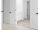 Bright bathroom featuring white cabinets, double doors, and a sleek design for a modern aesthetic at 2949 Jefferson St, Austell, GA 30106