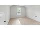 Bright bedroom features neutral carpeting, a window, and closet doors at 2949 Jefferson St, Austell, GA 30106