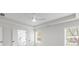 Light filled bedroom with tray ceiling, ceiling fan and bathroom entrance at 2949 Jefferson St, Austell, GA 30106