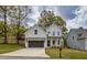 Charming two-story home with a well-manicured lawn and a two-car garage at 2949 Jefferson St, Austell, GA 30106