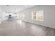 Bright open-concept living space with light wood floors and a modern kitchen with a blue island at 2949 Jefferson St, Austell, GA 30106