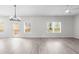 Spacious living room with light-colored floors, large windows, and a door to the backyard at 2949 Jefferson St, Austell, GA 30106