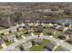 Aerial view of homes in a neighborhood that back onto a body of water with nearby walking paths at 3243 Shoals Park Dr, Decatur, GA 30034
