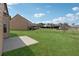 Large backyard with a concrete patio and lush green lawn, perfect for outdoor activities at 3243 Shoals Park Dr, Decatur, GA 30034