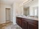 Bathroom features a double sink vanity with a tiled floor and a shower with glass doors at 3243 Shoals Park Dr, Decatur, GA 30034