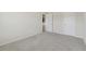 This bedroom provides neutral carpeting, trim and a connected bathroom at 3243 Shoals Park Dr, Decatur, GA 30034