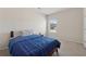 Bedroom with neutral walls, carpet, and a large window at 3243 Shoals Park Dr, Decatur, GA 30034