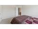 This bedroom offers neutral carpeting and a connected bathroom at 3243 Shoals Park Dr, Decatur, GA 30034