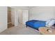 This bedroom offers neutral carpeting, a comfortable bed and a connected bathroom at 3243 Shoals Park Dr, Decatur, GA 30034