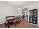 Elegant dining room with hardwood floors and a view of the modern kitchen at 3243 Shoals Park Dr, Decatur, GA 30034