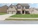 Charming two-story brick home with a well-maintained lawn and mature landscaping at 3243 Shoals Park Dr, Decatur, GA 30034
