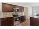 Modern kitchen featuring stainless steel appliances, granite countertops, and tile backsplash at 3243 Shoals Park Dr, Decatur, GA 30034