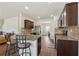 View of the kitchen featuring dark cabinetry and granite counters with breakfast bar seating at 3243 Shoals Park Dr, Decatur, GA 30034