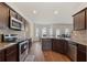 Modern kitchen featuring granite countertops, stainless appliances, and dark wood cabinetry at 3243 Shoals Park Dr, Decatur, GA 30034