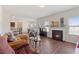 Bright living room with hardwood floors, fireplace, and an open layout to the kitchen and dining area at 3243 Shoals Park Dr, Decatur, GA 30034